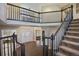 Grand two-story entry with hardwood floors, elegant staircase, and natural light at 4291 W Lake N Cir, Littleton, CO 80123