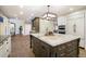 Elegant kitchen with expansive island and breakfast bar, perfect for entertaining at 4291 W Lake N Cir, Littleton, CO 80123