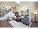 Two-story living room with hardwood floors and sectional sofa at 4291 W Lake N Cir, Littleton, CO 80123