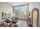 Living room with a fireplace and large windows at 4291 W Lake N Cir, Littleton, CO 80123