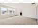 Spacious primary bedroom with plush carpet flooring and a door leading to the ensuite bathroom at 4600 Thistle Dr, Brighton, CO 80601
