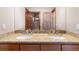 Elegant bathroom with a double vanity and granite countertops, showcasing modern fixtures at 10370 Grande Vista Ct, Lone Tree, CO 80124