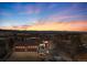 Beautiful home featuring a front yard, large driveway, and an attached three-car garage at sunset at 10370 Grande Vista Ct, Lone Tree, CO 80124