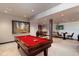 Bright and open game room with a pool table, and lounge area for entertaining guests at 10370 Grande Vista Ct, Lone Tree, CO 80124
