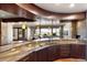 Gourmet kitchen with granite countertops, stainless steel appliances, and an open view to the living area at 10370 Grande Vista Ct, Lone Tree, CO 80124
