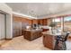 Well-equipped kitchen includes custom cabinets, a central island, and a breakfast bar at 10370 Grande Vista Ct, Lone Tree, CO 80124