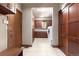 Spacious laundry room with washer and dryer, wood doors, and tile floor at 10370 Grande Vista Ct, Lone Tree, CO 80124