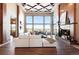 Spacious living room featuring large windows and a cozy fireplace at 10370 Grande Vista Ct, Lone Tree, CO 80124