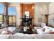 Inviting living room showcasing a stone fireplace, modern decor, and comfortable seating at 10370 Grande Vista Ct, Lone Tree, CO 80124
