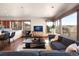 Bright, open living area features hardwood floors, large windows, and comfortable seating at 10370 Grande Vista Ct, Lone Tree, CO 80124