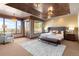 Spacious main bedroom with large windows and a seating area at 10370 Grande Vista Ct, Lone Tree, CO 80124