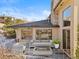 Relaxing side patio with outdoor seating and fire pit at 10370 Grande Vista Ct, Lone Tree, CO 80124