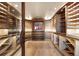 Temperature-controlled wine cellar featuring custom wood racking and ample storage space at 10370 Grande Vista Ct, Lone Tree, CO 80124