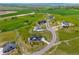 Aerial view of luxury homes in a sprawling green landscape, showcasing the property's unique location at 3125 Red Kit Rd, Franktown, CO 80116