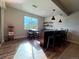 Finished basement bar featuring counter seating, shelving, and a unique popcorn machine at 3125 Red Kit Rd, Franktown, CO 80116