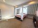 Charming bedroom featuring a canopy bed, stylish decor, and natural light at 3125 Red Kit Rd, Franktown, CO 80116