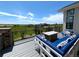 Beautiful deck with comfortable seating, overlooking a lush green landscape, perfect for outdoor relaxation at 3125 Red Kit Rd, Franktown, CO 80116