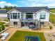 The back of the house boasts a deck with comfortable seating, a hot tub, and a trampoline for outdoor fun at 3125 Red Kit Rd, Franktown, CO 80116