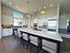 Spacious kitchen featuring a large island with bar seating, modern appliances, and ample natural light at 3125 Red Kit Rd, Franktown, CO 80116