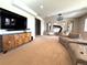 Open-concept living room featuring stylish furnishings, a large TV, and ample space for comfortable living at 3125 Red Kit Rd, Franktown, CO 80116