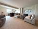 Comfortable living room with carpet, wet bar, and a sleek fireplace, perfect for relaxation and entertaining at 3125 Red Kit Rd, Franktown, CO 80116