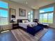 Spacious main bedroom featuring large windows with beautiful views, stylish decor, and ample natural light at 3125 Red Kit Rd, Franktown, CO 80116