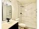 Bathroom with marble shower and modern vanity at 8468 Thunder Ridge Way # 202, Highlands Ranch, CO 80126