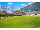 Expansive backyard featuring a well-maintained lawn and a deck, ideal for outdoor activities and relaxation at 978 Mercury Cir, Lone Tree, CO 80124