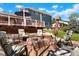 Backyard with a fire pit area, surrounded by comfortable seating, perfect for evening gatherings at 978 Mercury Cir, Lone Tree, CO 80124