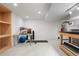 Bright and spacious basement room for recreation and storage with desk, exercise mat, and storage shelving at 978 Mercury Cir, Lone Tree, CO 80124