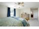 Bedroom with large windows, neutral decor, and light-wood dresser at 978 Mercury Cir, Lone Tree, CO 80124