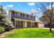 Inviting two-story home showcasing brick accents, gray siding, a charming porch, and a well-maintained lawn at 978 Mercury Cir, Lone Tree, CO 80124