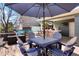 Spacious patio with outdoor kitchen, hot tub and dining area perfect for entertaining guests at 978 Mercury Cir, Lone Tree, CO 80124