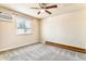 Neutral bedroom featuring a ceiling fan, window with natural light, and climate control unit at 155 S Pennsylvania St # 311, Denver, CO 80209