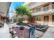 Brick apartment courtyard with an ornamental tree and a 