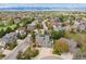 Beautiful aerial view of a home with lush landscaping in a neighborhood featuring stunning mountain views at 10029 Winterthur Ct, Highlands Ranch, CO 80129
