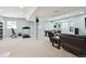Finished basement with a lounge area, billiards table, and workout equipment, offering ample space at 10029 Winterthur Ct, Highlands Ranch, CO 80129
