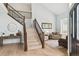 Spacious entryway with hardwood floors, staircase, and views of the living area at 10029 Winterthur Ct, Highlands Ranch, CO 80129