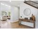 Welcoming entryway with a wooden console table, decorative vases, and hardwood floors at 10029 Winterthur Ct, Highlands Ranch, CO 80129
