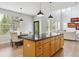 Spacious kitchen with an island, seating, and an adjacent breakfast nook and living area at 10029 Winterthur Ct, Highlands Ranch, CO 80129