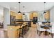 Bright kitchen with stainless steel appliances, an island with seating, and a breakfast nook at 10029 Winterthur Ct, Highlands Ranch, CO 80129