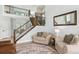 Cozy living room featuring comfortable seating, a large mirror, and an open layout at 10029 Winterthur Ct, Highlands Ranch, CO 80129