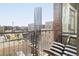 Cozy balcony with seating and city views makes for a lovely outdoor space at 2100 16Th St # 405, Denver, CO 80202