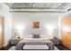 Modern bedroom with neutral decor, concrete ceiling, and stylish lighting at 2100 16Th St # 405, Denver, CO 80202