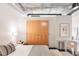 Bedroom featuring a built in closet, neutral decor, and stylish lighting at 2100 16Th St # 405, Denver, CO 80202