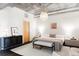 Modern bedroom with concrete ceiling and white textured rug at 2100 16Th St # 405, Denver, CO 80202