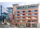 Exterior facade of a modern apartment building with glass accents at 2100 16Th St # 405, Denver, CO 80202