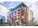 Modern brick apartment building with glass accents and unique roofline at 2100 16Th St # 405, Denver, CO 80202