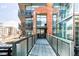 Modern apartment building with a walkway leading to the entrance at 2100 16Th St # 405, Denver, CO 80202