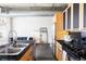 Open concept kitchen boasts stainless appliances, sleek countertops, and is open to the living area at 2100 16Th St # 405, Denver, CO 80202